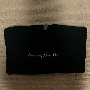 Something about her sweatshirt